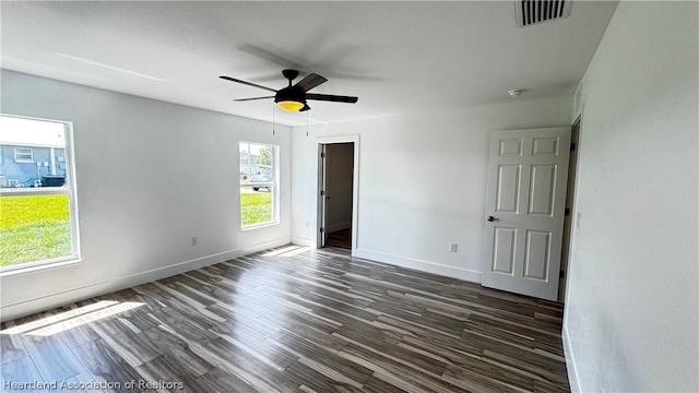 unfurnished room featuring dark hardwood / wood-style flooring and ceiling fan