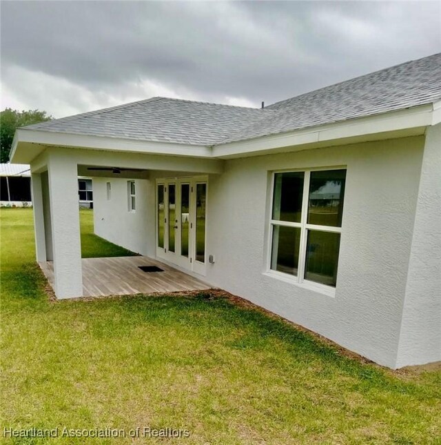 ranch-style house featuring a front yard and a garage