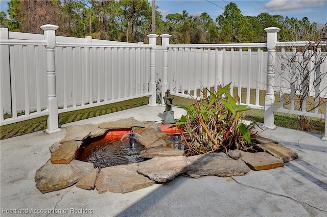 exterior space with a fenced backyard