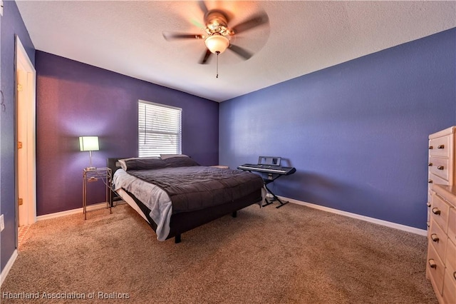 bedroom with carpet floors, ceiling fan, a textured ceiling, and baseboards