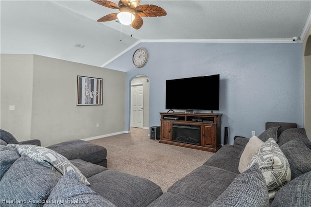 living room with arched walkways, carpet flooring, vaulted ceiling, ceiling fan, and baseboards