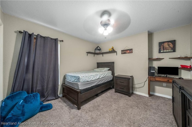 bedroom featuring a ceiling fan, carpet, and baseboards