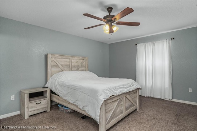 bedroom featuring carpet floors, baseboards, a ceiling fan, and a textured wall