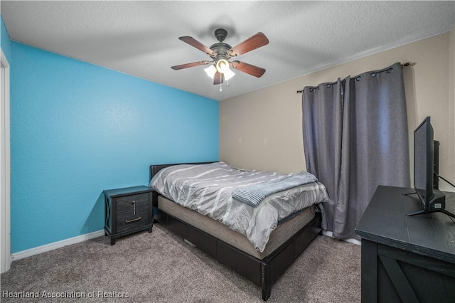 bedroom with carpet floors, baseboards, a ceiling fan, and a textured ceiling