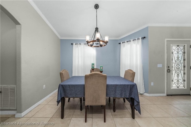 dining room with light tile patterned floors, visible vents, and crown molding