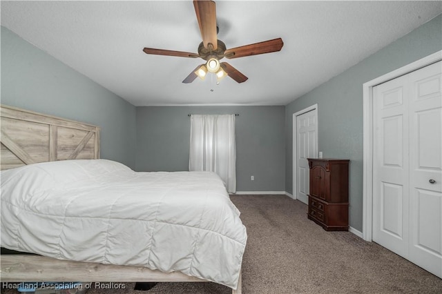 carpeted bedroom featuring ceiling fan and baseboards