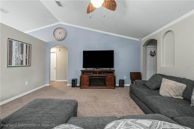 carpeted living room featuring arched walkways, visible vents, vaulted ceiling, ceiling fan, and baseboards