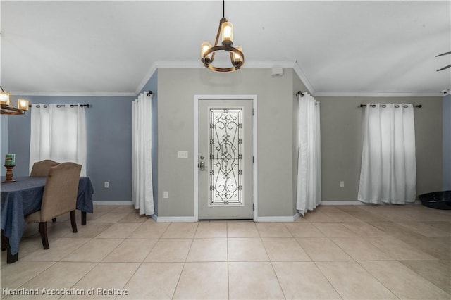 foyer entrance featuring ornamental molding, light tile patterned floors, baseboards, and an inviting chandelier