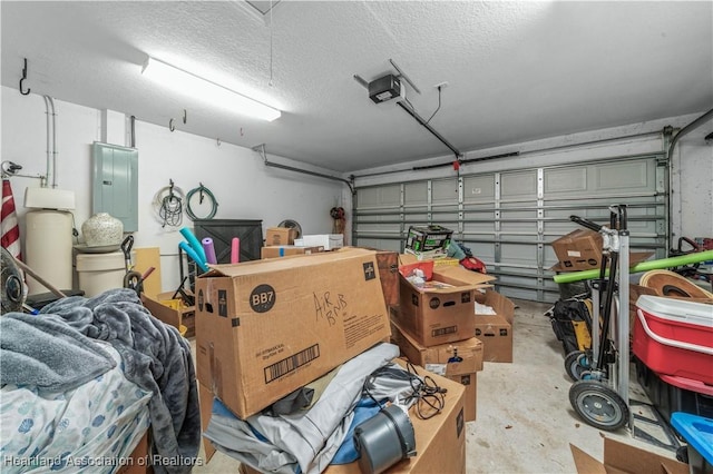 garage with electric panel and a garage door opener