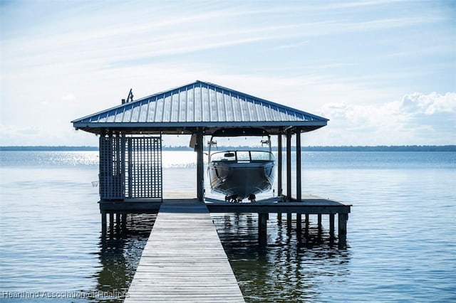 view of dock with a water view and boat lift