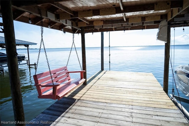 view of dock with a water view and boat lift