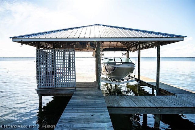 view of dock featuring a water view and boat lift