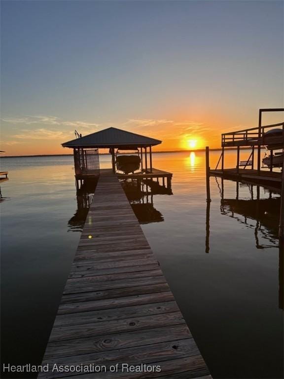 view of dock with a water view and boat lift