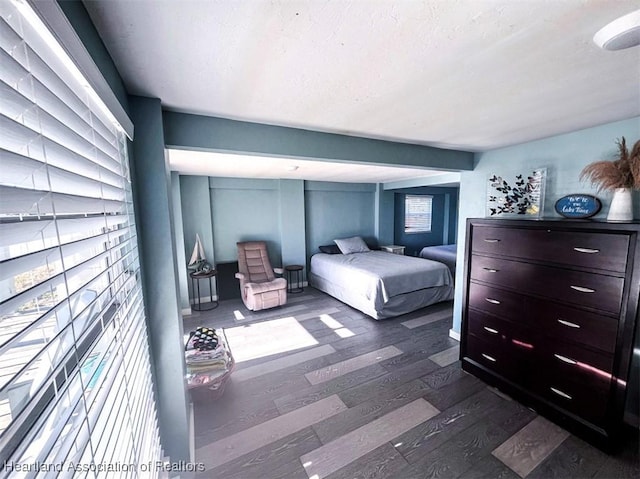 bedroom with dark wood-style floors