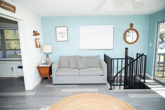 living room featuring baseboards and wood finished floors