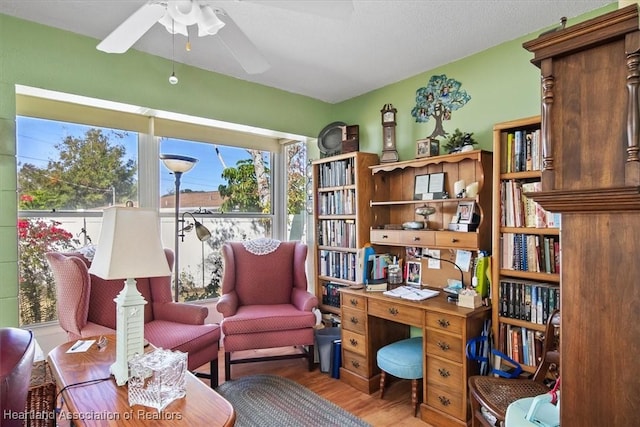 office space featuring ceiling fan and light hardwood / wood-style floors