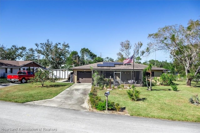 ranch-style home with a front yard, solar panels, a garage, and a sunroom