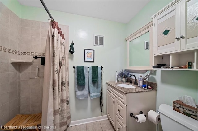 bathroom featuring tile patterned flooring, a shower with curtain, toilet, and vanity