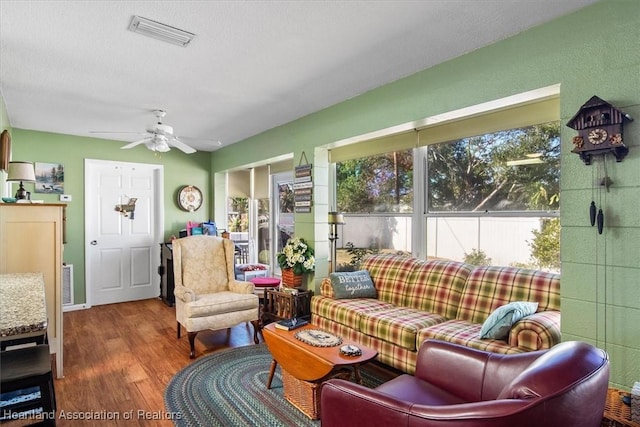 sunroom featuring ceiling fan