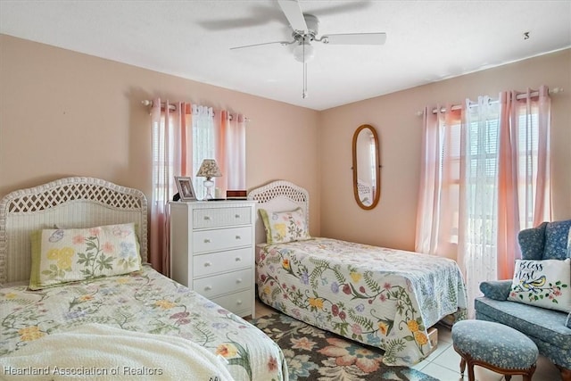 bedroom featuring ceiling fan and light tile patterned flooring