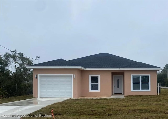 single story home featuring a garage and a front lawn