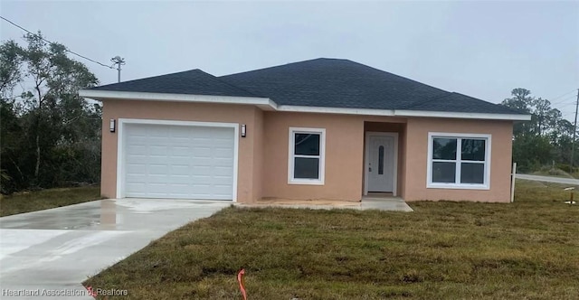 single story home with a garage and a front yard