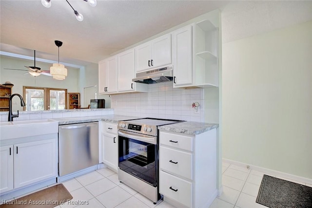 kitchen with white cabinetry, sink, ceiling fan, backsplash, and appliances with stainless steel finishes