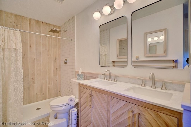 bathroom with a shower with curtain, vanity, and toilet