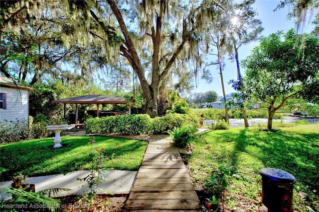 view of community with a gazebo and a lawn