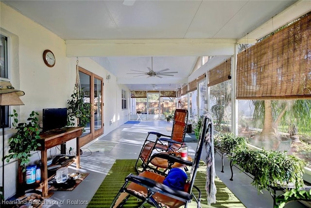 sunroom / solarium with french doors, ceiling fan, and lofted ceiling