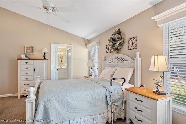 bedroom with lofted ceiling, connected bathroom, ceiling fan, and carpet