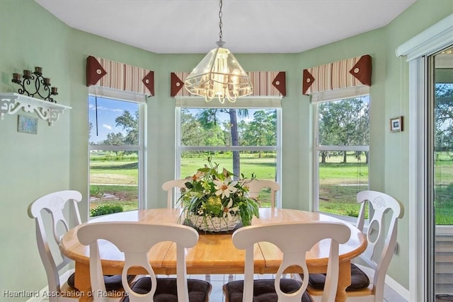 sunroom with a notable chandelier