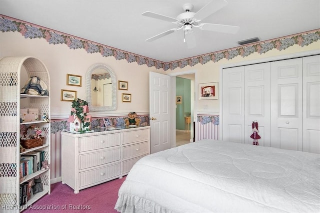 carpeted bedroom featuring a closet and ceiling fan