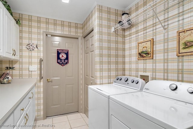 washroom featuring cabinets, independent washer and dryer, ornamental molding, and light tile patterned floors