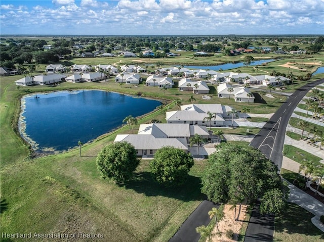 birds eye view of property with a residential view and a water view