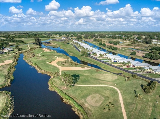 aerial view with a residential view, golf course view, and a water view