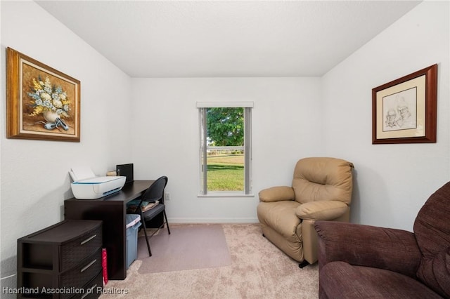 carpeted office space featuring baseboards
