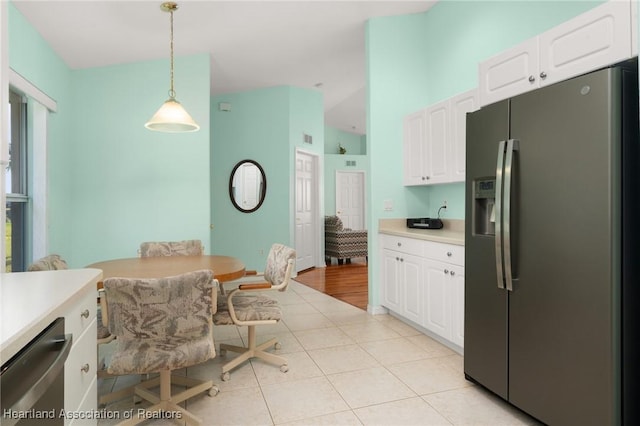 kitchen with white cabinets, light countertops, and appliances with stainless steel finishes