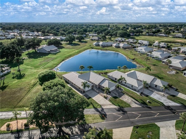 drone / aerial view with a residential view and a water view