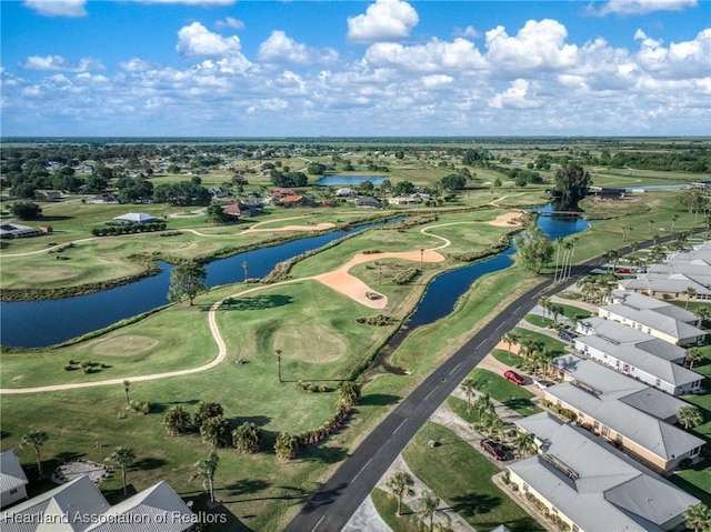 bird's eye view featuring view of golf course, a water view, and a residential view