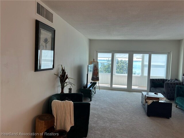 2131 Lakeview Dr Unit 400, Sebring, FL 33870 - carpeted living room with a textured ceiling