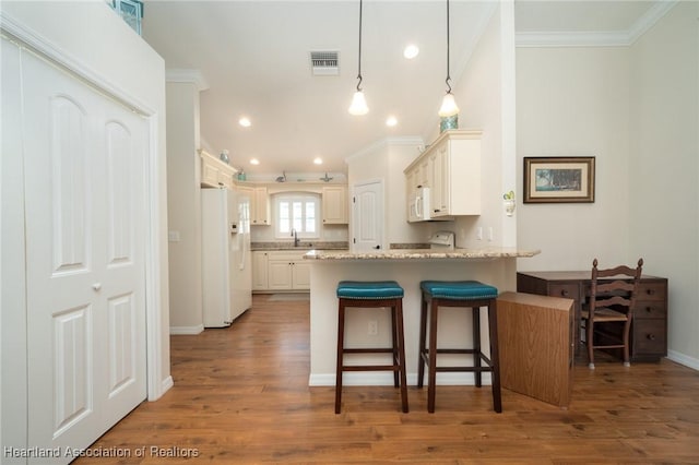 kitchen featuring pendant lighting, white appliances, light stone counters, ornamental molding, and kitchen peninsula