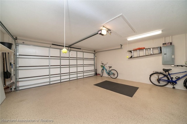 garage with a garage door opener and electric panel