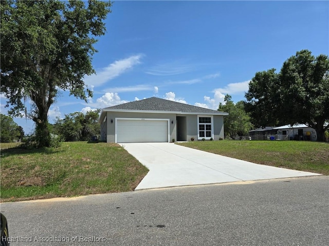 view of front of home featuring a garage and a front yard