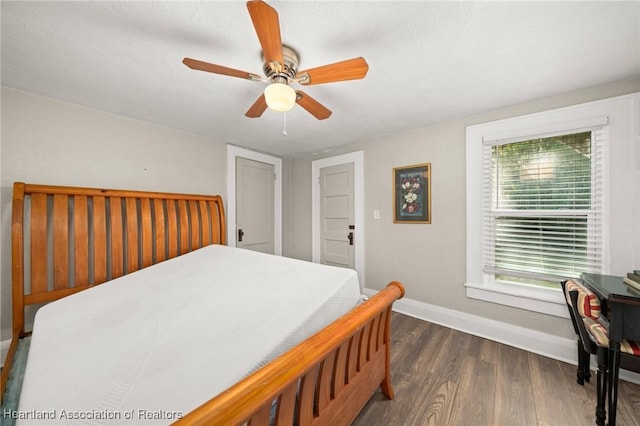 412 Rose Ave, Sebring, FL 33870 - bedroom featuring baseboards, wood finished floors, and ceiling fan