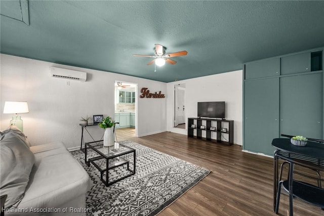 412 Rose Ave, Sebring, FL 33870 - living room featuring attic access, a ceiling fan, dark wood-type flooring, and an AC wall unit