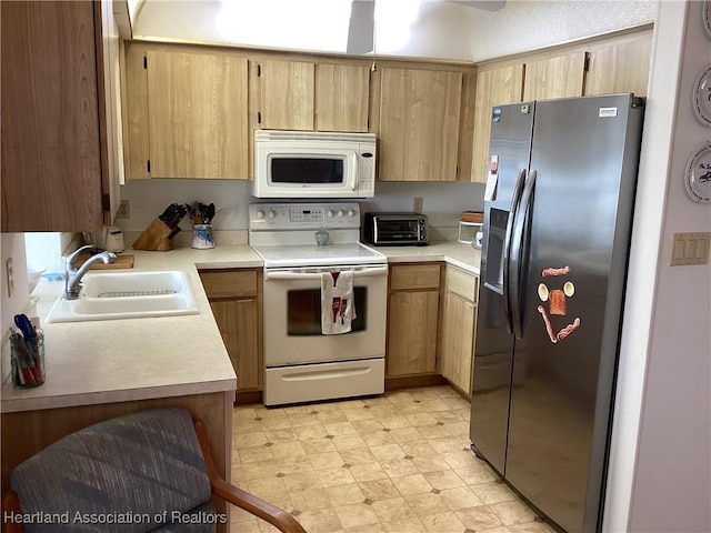 kitchen with white appliances and sink