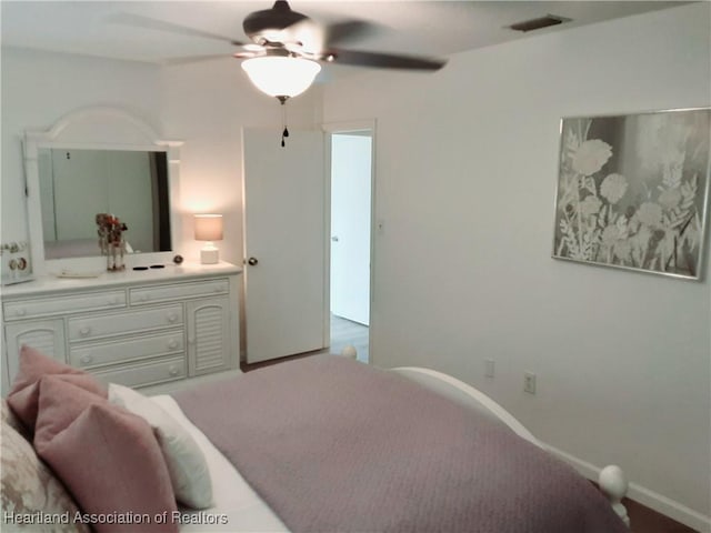 200 Robin Ave, Sebring, FL 33870 - carpeted bedroom with baseboards and a ceiling fan