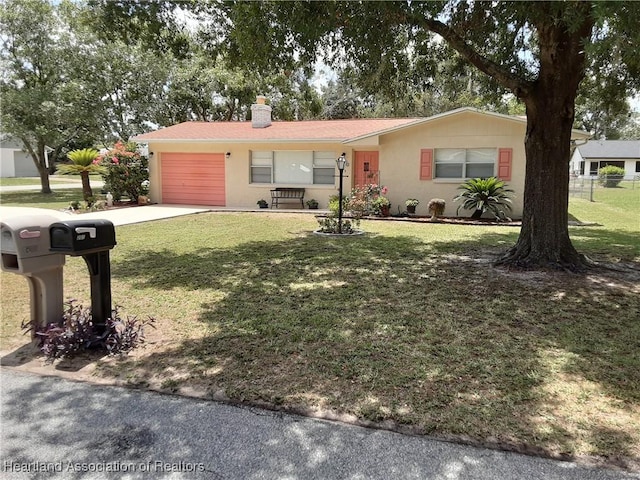 200 Robin Ave, Sebring, FL 33870 - ranch-style home featuring a garage, concrete driveway, a chimney, and a front yard