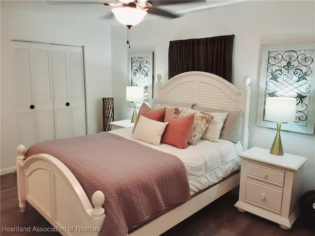 200 Robin Ave, Sebring, FL 33870 - bedroom with dark wood-style floors, a closet, ceiling fan, and baseboards